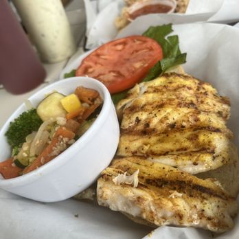 Dockside Dave's - Lemon pepper Grouper sandwich with side veggie. (Calamari in background) - Seafood Near Me - Madeira Beach, Florida Dockside Dave's - Lemon pepper Grouper sandwich with side veggie. (Calamari in background) - Seafood Near Me - Madeira Beach, Florida