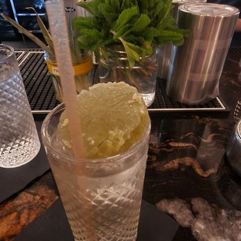 The Moderne - Wabsabi Vodka cucumber with a matcha candy - Tapas/Small Plates Near Me - Orlando, Florida The Moderne - Wabsabi Vodka cucumber with a matcha candy - Tapas/Small Plates Near Me - Orlando, Florida