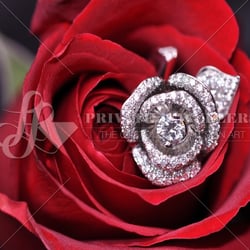 LL Private Jewellers - Custom diamond rose ring containing 258 round brilliant cut diamonds and 0.46 carat round brilliant cut diamond. The diamonds ar