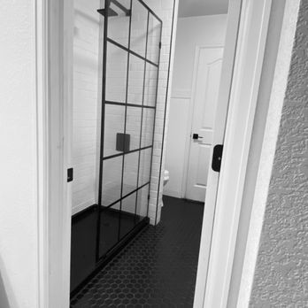 JBX Renovations - a black and white photo of a bathroom - General Contractors Near Me