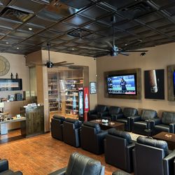 Helios Cigar Lounge - Lounge area, humidor, and register