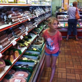 Schmidt's Meat Market - a young girl in a grocery store - Meat Shops Near Me - Nicollet, Minnesota Schmidt's Meat Market - a young girl in a grocery store - Meat Shops Near Me - Nicollet, Minnesota