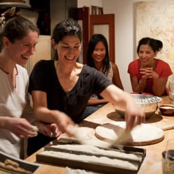Valentina looking at a student while she is shaping her own baguette. The best feeling!