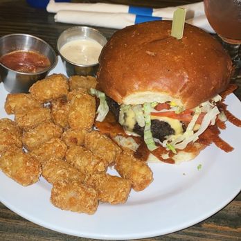 The Blue Duck - Burger of the month with tots - Sandwiches Near Me - Maplewood, Missouri The Blue Duck - Burger of the month with tots - Sandwiches Near Me - Maplewood, Missouri