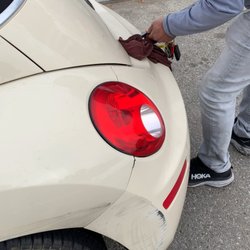 E & M Automotive - Edward trying to force my trunk open when there was an emergency latch assessable through the backseat which he refused to use