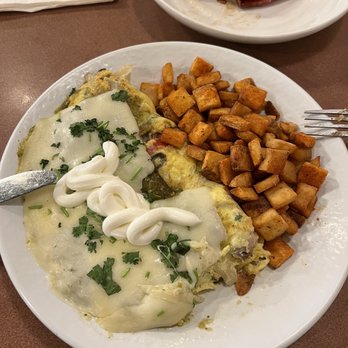 The Cracked Egg - Carnitas omelet with seasoned fries and a side of polish sausage - Breakfast & Brunch Near Me - Las Vegas, Nevada