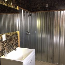 Home Resort - Man cave bathroom in garage