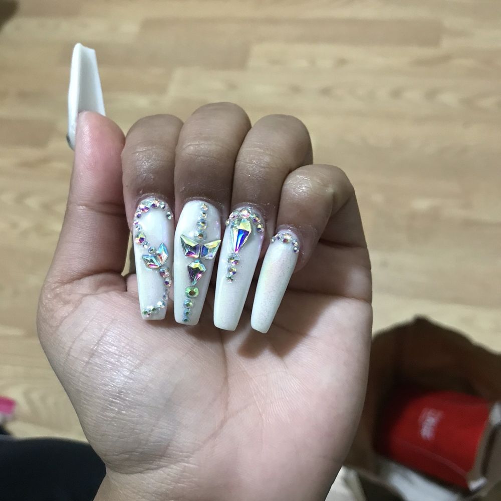 Middle finger diamonds are way off center