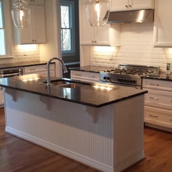 Triangle Cabinets & Renovations - Open layout with room for seating at island and L.E.D. lighting underneath the wall cabinets. (North Hills) Raleigh, NC - General Contractors Near Me - Raleigh, North Carolina