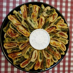 Pizza Man's Pizza - Pepperoni rolls and spinach roll trays for all occasions.