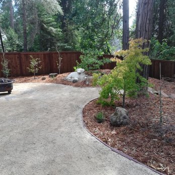 MountainSide Landscaping - Decomposed granite patio. Decorative boulders, slate fire pit, planting, cedar bark, steps,  RV parking area, redwood fence. - Landscaping Near Me