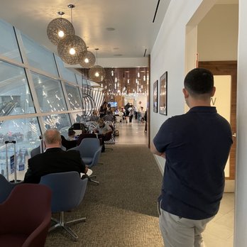 The Centurion Lounge - Seating area and restrooms to the right - Airport Lounges Near Me - Dallas, Texas The Centurion Lounge - Seating area and restrooms to the right - Airport Lounges Near Me - Dallas, Texas