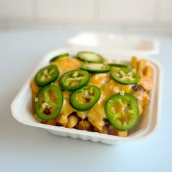 7th Street Burger Park Slope - Spicy loaded fries topped with fresh jalapeños, seasoned beef, and signature ghost pepper sauce from 7th Street Burger...