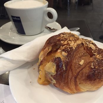 Fellini Caffè - Almond croissant + cappuccino with Almond milk. - Italian Near Me - Houston, Texas Fellini Caffè - Almond croissant + cappuccino with Almond milk. - Italian Near Me - Houston, Texas