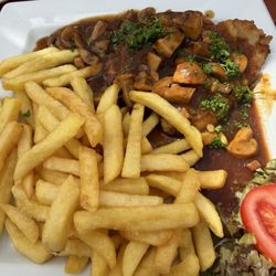 Das Spiessbratenhaus - Schnitzels with pomme fries and mushroom Gravy