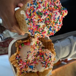 Vanilla cone with sprinkles,  cherry cheesecake with sprinkles