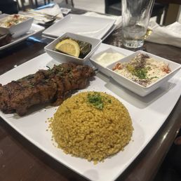 Shish kabob with dolma and bulgar and Baba Ghanoush