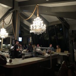 Chandelier over the bar. Cute idea!!