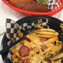 Bolidelicias Colombianas - Salchipapas Junior (small portion) and empanadas.