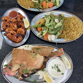 Ghadir Fish Restaurant - Grilled Shrimps and Grilled Red Snapper + sides (rice, mixed vegetables) - come with complimentary pita bread - Seafood Near Me - Scarborough, Ontario Ghadir Fish Restaurant - Grilled Shrimps and Grilled Red Snapper + sides (rice, mixed vegetables) - come with complimentary pita bread - Seafood Near Me - Scarborough, Ontario