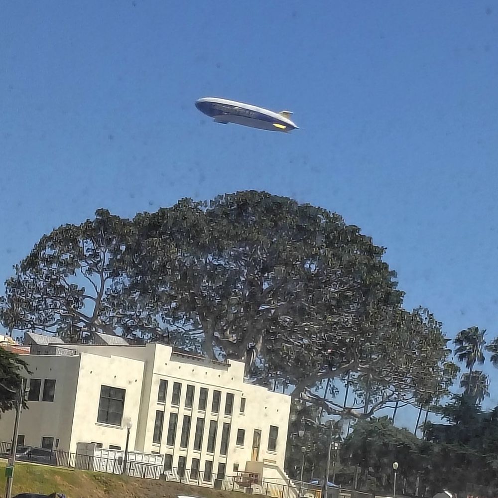 Good year blimp flew by as we were enjoying our food. Good year blimp flew by as we were enjoying our food.
