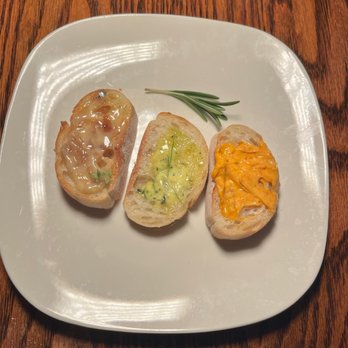 Michael's - Bread Service: Baguette with Trio of Butters - Smoked Tomato & Datil, Roasted Shallot & White Truffle, Confit Garlic & Herb - Seafood Near Me - St. Augustine, Florida