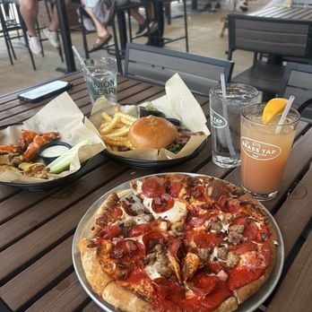 The Brass Tap - Prosper - carnivore pizza, buffalo and lemon pepper wings, bacon burger and the weekender drink. - Beer Bar Near Me - Prosper, Texas