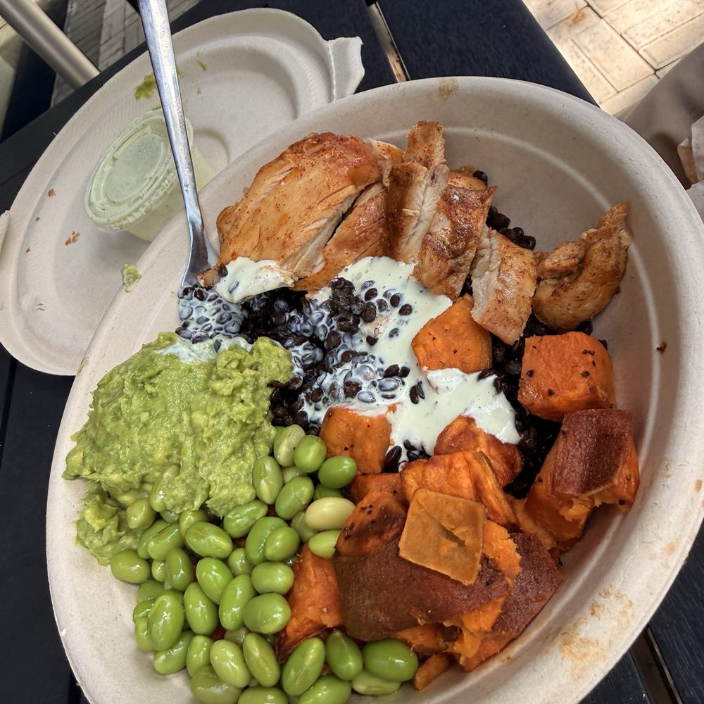 Just Salad - seasoned grilled chicken paired with roasted sweet potatoes, fresh edamame, a rich black lentil base, and a scoop of flavorful guacamole - Salad Near Me - Miami, Florida Just Salad - seasoned grilled chicken paired with roasted sweet potatoes, fresh edamame, a rich black lentil base, and a scoop of flavorful guacamole - Salad Near Me - Miami, Florida