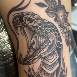 Fu Dog Tattoo - Traditional sanake tatto done by wacho @Fu dog tattoo