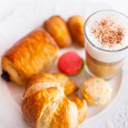 Le Macaron French Pastries - Pair an authentic French pastry with expertly prepared Lavazza coffee for a delightful café experience.