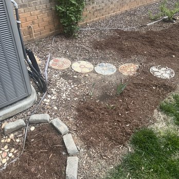 Universal Helpers - The mulch is not even an inch deep here and not even to the foundation of the house - Junk Removal & Hauling Near Me