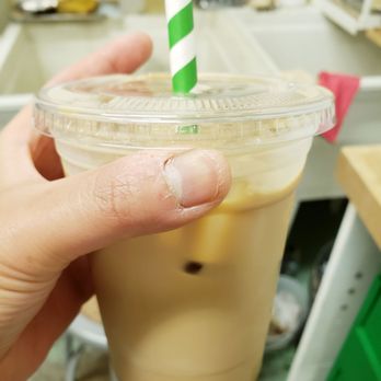 Hayan Mug - a hand holding a cup of iced coffee - Coffee & Tea Near Me - Vancouver, British Columbia Hayan Mug - a hand holding a cup of iced coffee - Coffee & Tea Near Me - Vancouver, British Columbia