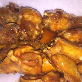 Wings To Go - a plate of chicken wings with sauce - Chicken Wings Near Me - Dover, Delaware