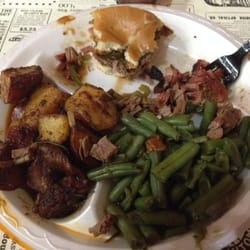 Texas Best Smokehouse II - Quickly eating my brisket sammie and two sides w a drink $7. Quality spicey bbq sauce.
