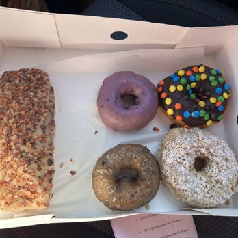 Randy’s Donuts - Bacon Maple long john, blueberry cake, blueberry iced cake, m&m raised, butter crumb raised. Not pictured is the chocolate long john - Coffee & Tea Near Me - San Diego, California Randy’s Donuts - Bacon Maple long john, blueberry cake, blueberry iced cake, m&m raised, butter crumb raised. Not pictured is the chocolate long john - Coffee & Tea Near Me - San Diego, California