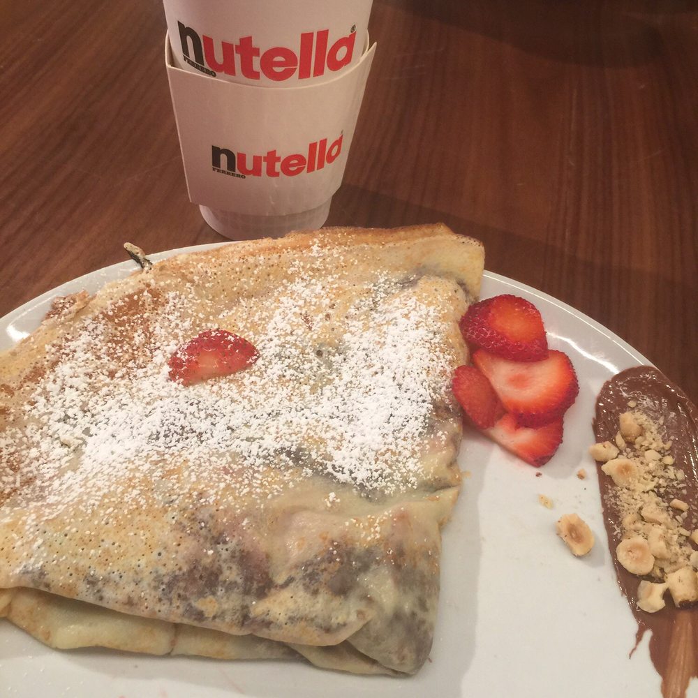 Nutella Cafe - Latte was in a to go container and a strawberry /Nutella crepe - Desserts Near Me - Chicago, Illinois Nutella Cafe - Latte was in a to go container and a strawberry /Nutella crepe - Desserts Near Me - Chicago, Illinois