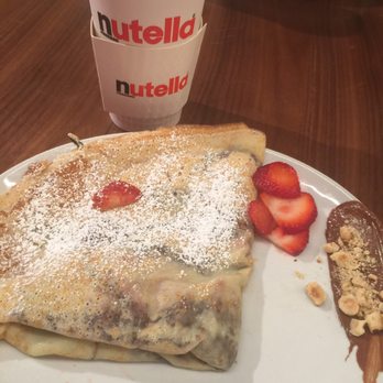 Nutella Cafe - Latte was in a to go container and a strawberry /Nutella crepe - Desserts Near Me - Chicago, Illinois Nutella Cafe - Latte was in a to go container and a strawberry /Nutella crepe - Desserts Near Me - Chicago, Illinois