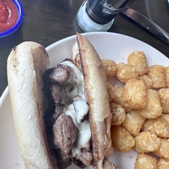 Wolf's Steakhouse - Philly Cheesesteak (half of it and Tater Tots) - Steakhouses Near Me - Cooper City, Florida Wolf's Steakhouse - Philly Cheesesteak (half of it and Tater Tots) - Steakhouses Near Me - Cooper City, Florida