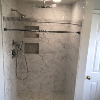 Omar Construction - a bathroom with a marble shower - General Contractors Near Me - Clifton, New Jersey Omar Construction - a bathroom with a marble shower - General Contractors Near Me - Clifton, New Jersey