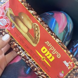 a person holding a box of food