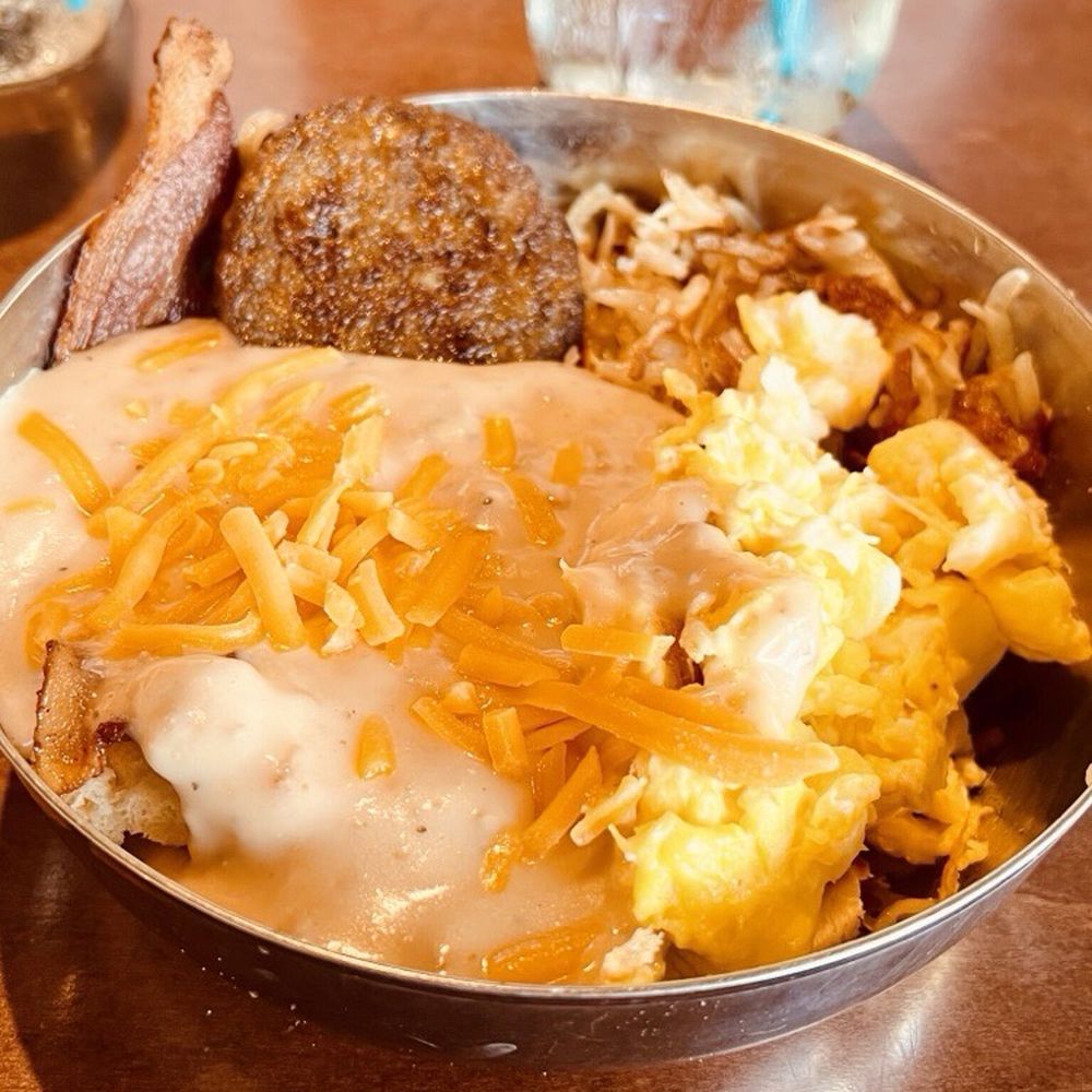 Magnolia Cafe - Risk it biscuit- flaky homemade biscuit with sausage gravy, bacon, sausage, scrambled eggs and homemade hash brown - Cafes Near Me - Fernandina Beach, Florida