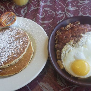Charlie's Restaurant - Corned beef hash skillet ($10, right) comes with 2 eggs any way and choice of toast or pancakes (left) - American Near Me - Bolingbrook, Illinois