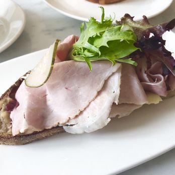 Lost Larson Bakery - Open faced smoked ham sandwich with dill havarti cheese, lingonberry jam, bread and butter pickles, and arugula - Coffee & Tea Near Me - Chicago, Illinois