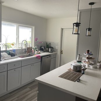 Vaqueros Construction - a kitchen with white cabinets and white countertops - General Contractors Near Me Vaqueros Construction - a kitchen with white cabinets and white countertops - General Contractors Near Me
