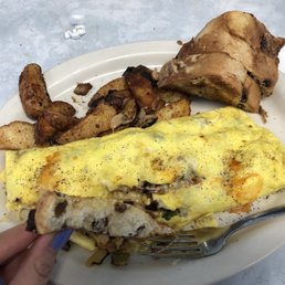 Diner omelette, home fries, and raisin bread
