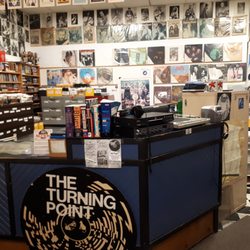 The Turning Point - Our work space/cash area which includes a listening station. You will often find some LP gems on our collectors wall behind the cash