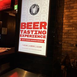 Long Arm Pub & Brewery - Advert by bar