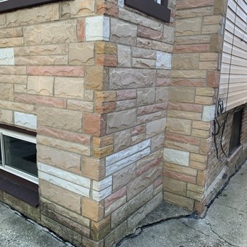 Second City Roofing & Exteriors - Old brick work and walk way where the walk way was separating from the building. - Roofing Near Me - Chicago, Illinois