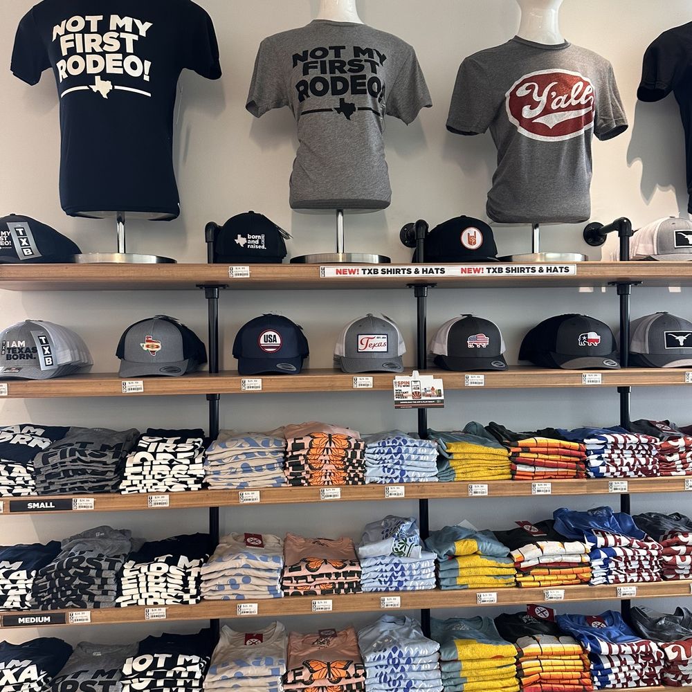 TXB - a variety of hats and t - shirts on display - Gas Stations Near Me - Kyle, Texas TXB - a variety of hats and t - shirts on display - Gas Stations Near Me - Kyle, Texas