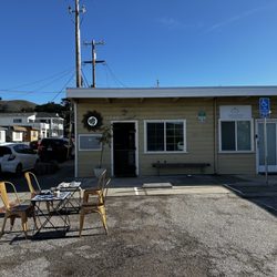 Golden Sol Wellness Bar - The start of what will hopefully become an outdoor seating area. Tables have chessboards.